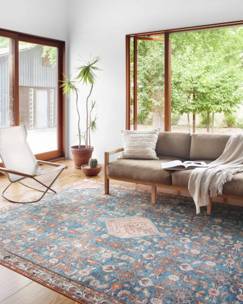 Layla Area Rug in Marine/Clay in living room 