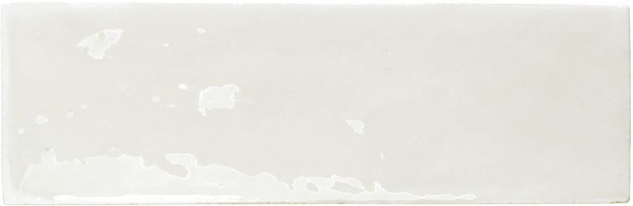 The Rebels 2" x 6" Matte Subway Tile is a rectangular white tile with a matte finish and subtle texture, ideal for creating a stylish accent wall.