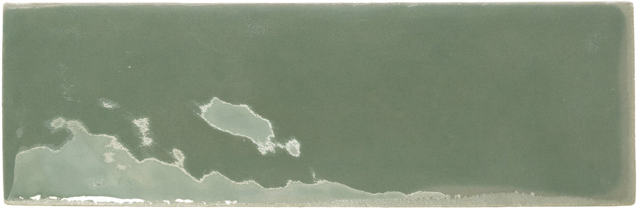 Rebels 2" x 6" Matte Subway Tile with an uneven green glaze and a lighter, cloudy patch along the bottom left edge, reminiscent of a watercolor effect—perfect for accent walls.