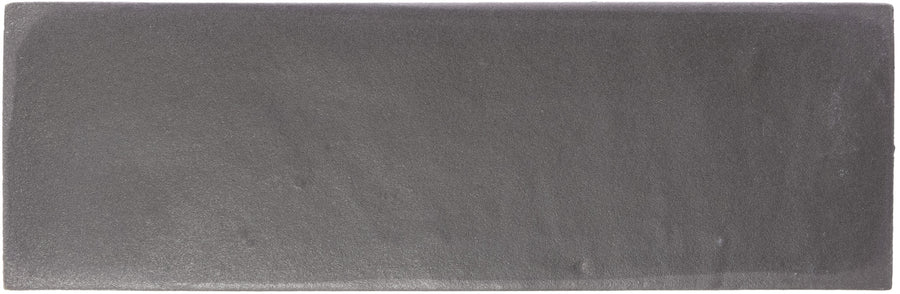 The Rebels 2" x 6" Matte Subway Tile in Nero Matte features a rectangular, flat design with a slightly textured surface and clean edges—perfect for accent walls or as a modern matte subway tile.