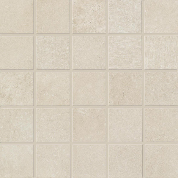 The Revolve 2x2 Mosaic Porcelain Tile features a grid of light beige, stone-like tiles with subtle texture and shading variations, separated by thin grout lines for a uniform, neutral look.