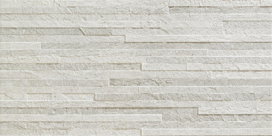 The Revolve 12x24 Muretto Porcelain Tile features a white brick pattern, offering a classic look that replicates decorative wall tile for added style.