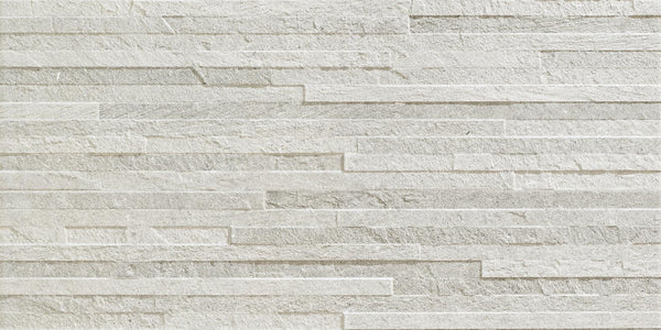 The Revolve 12x24 Muretto Porcelain Tile features a white brick pattern, offering a classic look that replicates decorative wall tile for added style.
