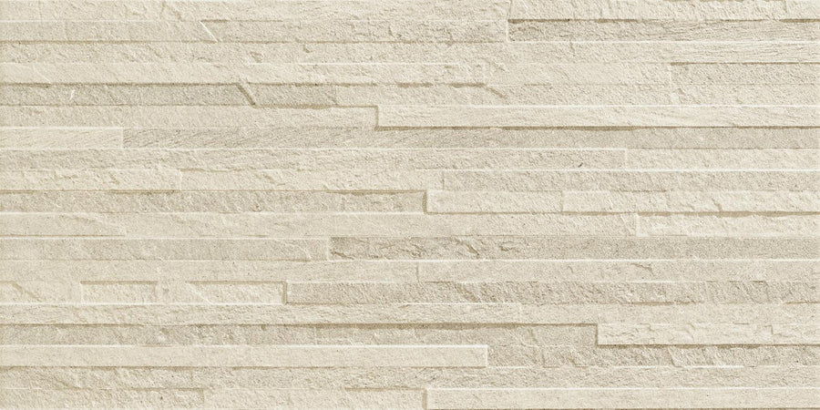 Revolve 12x24 Muretto Porcelain Tile features textured beige horizontal, staggered rectangular panels of varying lengths with a layered, contemporary look and a subtle natural stone finish.