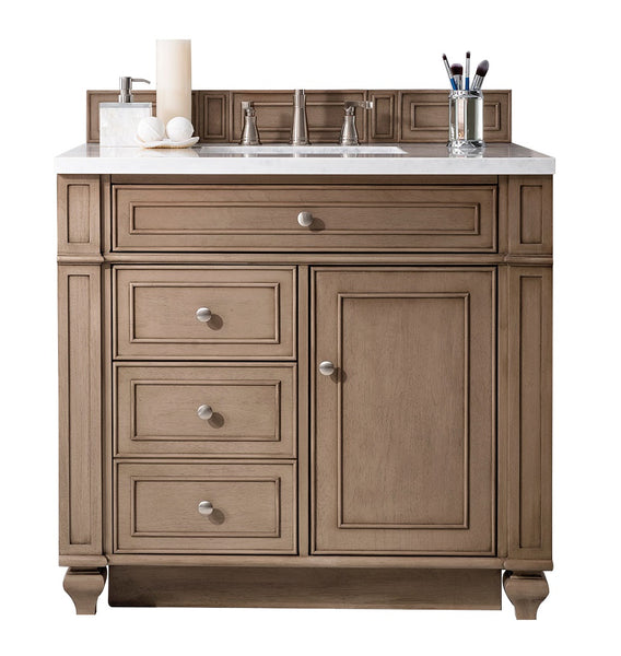 A wooden bathroom vanity with a white countertop, built-in sink, silver faucet, three drawers, one cabinet door, a soap dish with soap, a candle, and a cup holding makeup brushes.