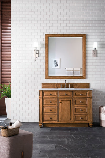 A bathroom featuring white subway tile walls, the Bristol 48
