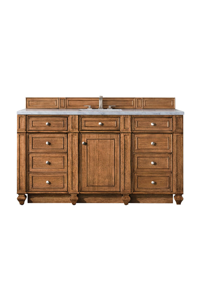 A wooden bathroom vanity with a white countertop, single sink, silver faucet, and multiple drawers and cabinet doors, set against a white background.