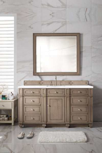 A luxury bathroom with beige marble walls, a large mirror above a Bristol 60