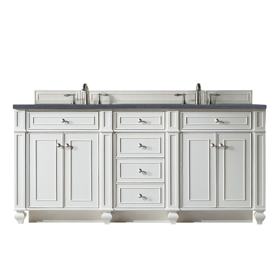 White double bathroom vanity with six drawers and four cabinet doors, featuring a dark countertop, two sinks with faucets, silver handles, and decorative legs.