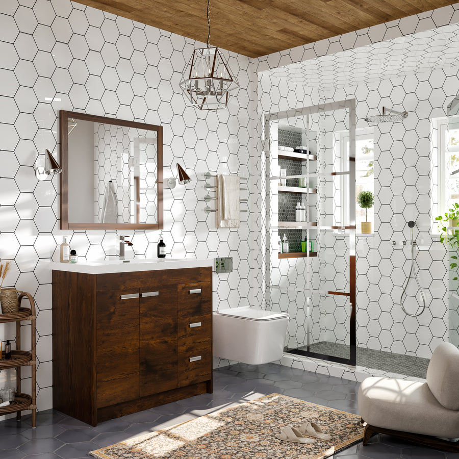 Modern bathroom with white hexagon tile walls, wooden vanity, large mirror, floating toilet, glass shower, and a patterned rug. Natural light streams in through windows; plants and shelves add decorative touches.