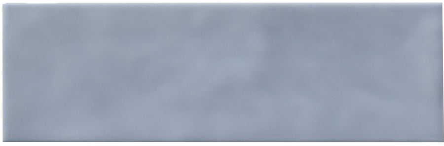 Zephyr 2.5x8 Ceramic Tile: A rectangular, light gray ceramic tile featuring a smooth, subtly clouded surface and gentle shading—ideal for Mediterranean-inspired spaces. Available by special order.