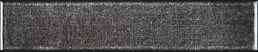 A close-up of the Texstyle 2" x 10" Combed Subway Tile in Midnight shows its dark, textured surface and densely woven white lines, with lighter edges that evoke a modern kitchen backsplash or framed fabric mesh.
