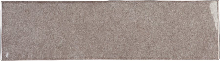 A rectangular, light brown bath mat with a simple, solid design and lightly textured surface—perfect for pairing with Radiance 3" x 10" Glossy Subway Tile in Ashen—photographed from above against a white background.