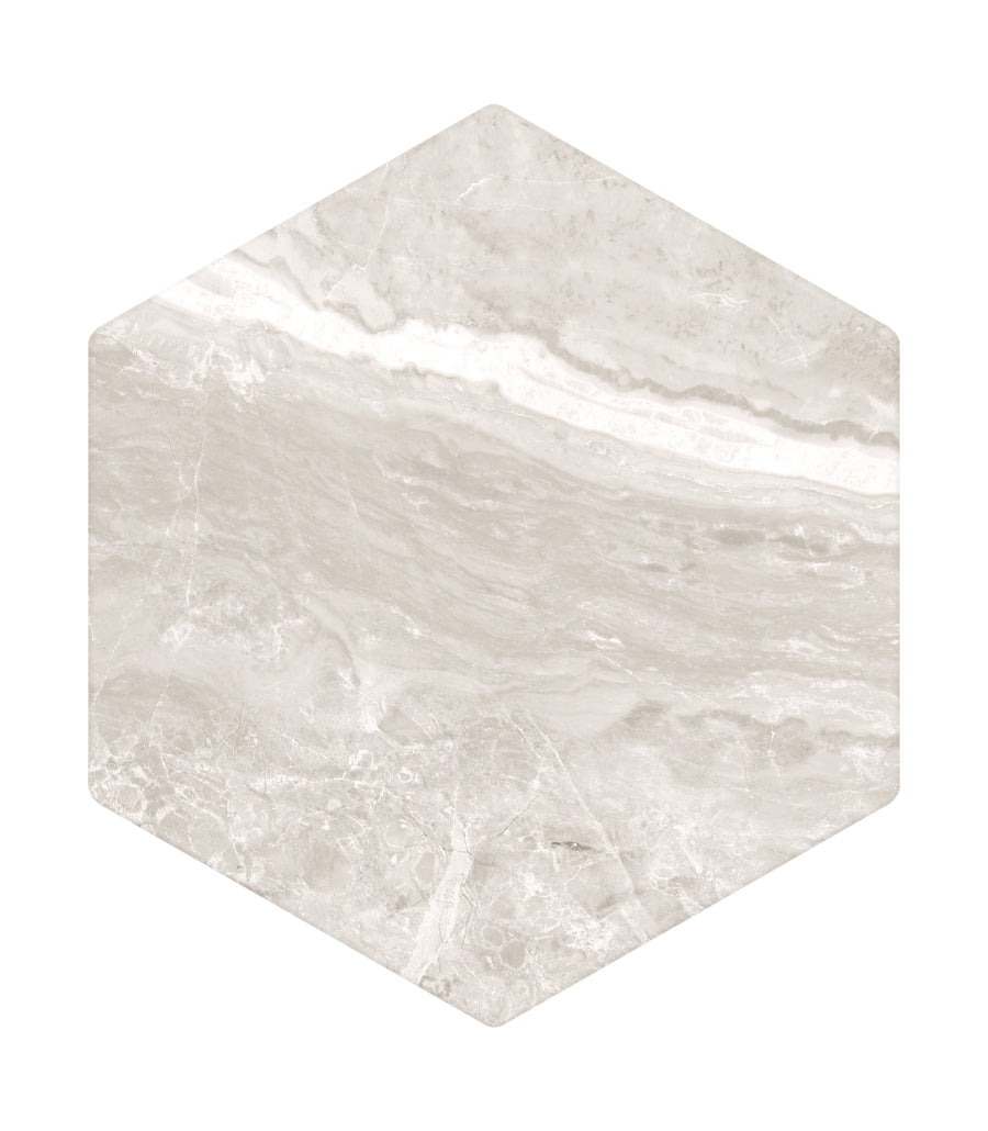 The Veil 8" x 8" Hex Tile in White Natural features a smooth, polished finish and subtle diagonal veining, creating a modern geometric look with authentic marble-inspired stone textures.