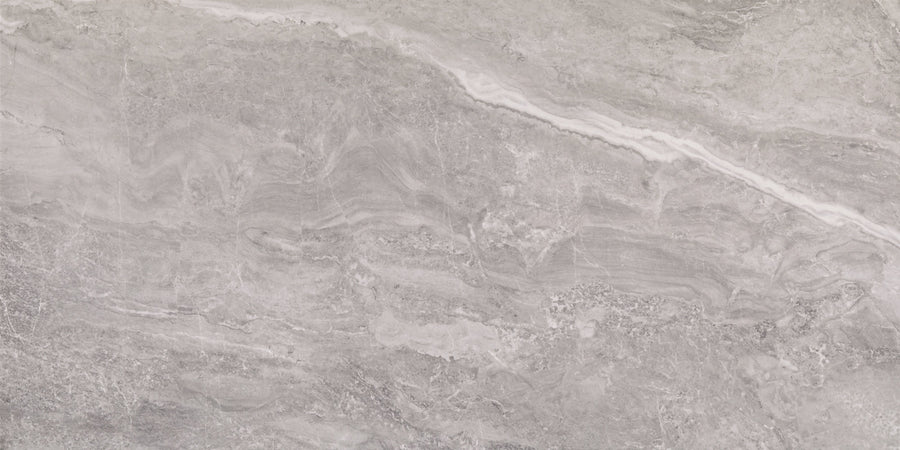 A close-up of the Veil 24" x 48" Tile in Mystic Polished highlights its smooth, polished gray surface with subtle white veining and natural swirling patterns, exemplifying timeless sophistication.