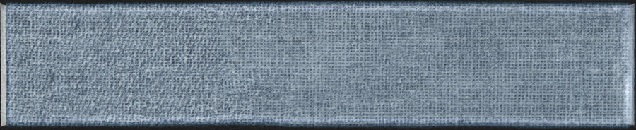 A close-up of the Texstyle 2" x 10" Combed Subway Tile in Seascape, showcasing its textured gray-blue surface with a subtle linear pattern—ideal for a modern kitchen backsplash.