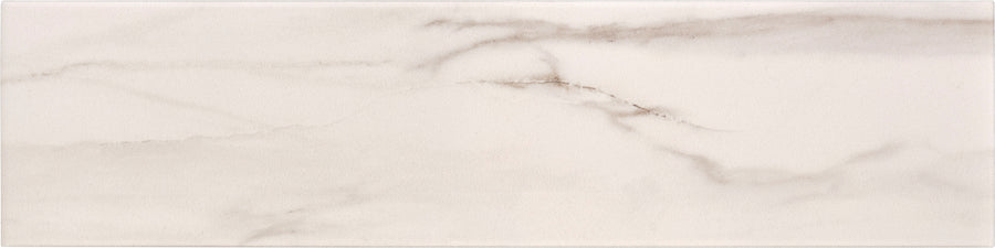 Lunara Haze 4" x 16" Subway Tile features a matte white background with light gray, marble-inspired veining. Its elongated rectangular shape adds a modern touch, perfect for accent walls or spaces seeking the elegance of natural stone.