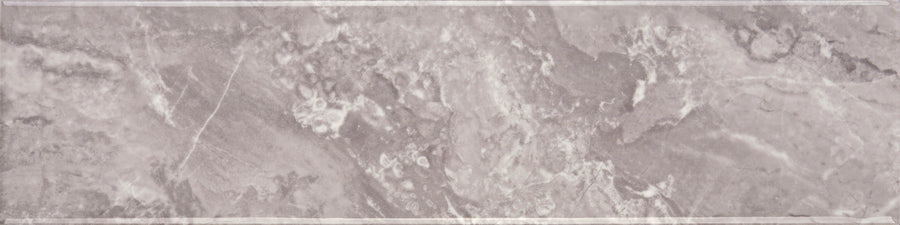 The Veil 4" x 16" Subway Tile in Mystic Glossy features a sleek, light grey finish with subtle white veining and a faint border, offering a textured and elegant look ideal for modern interiors.