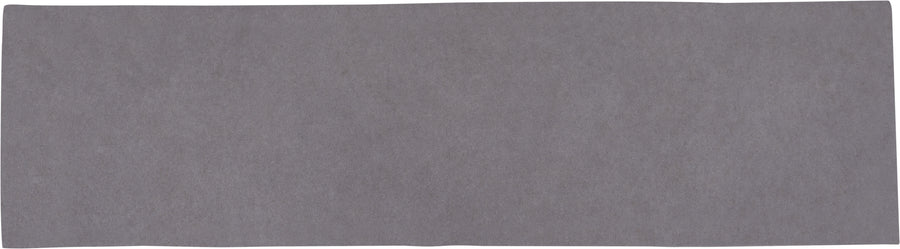 The Radiance 3" x 10" Glossy Subway Tile in Pompeii, shown against a white background, features a slightly textured gray surface and is perfect for accent walls or kitchen backsplashes.