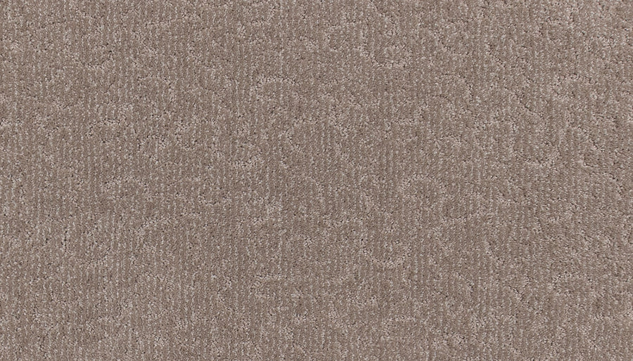 Close-up of Fleurious Pet Friendly Carpet in light brown, featuring a subtle swirling pattern and soft, slightly shiny fibers that create an inviting look with luxurious comfort.