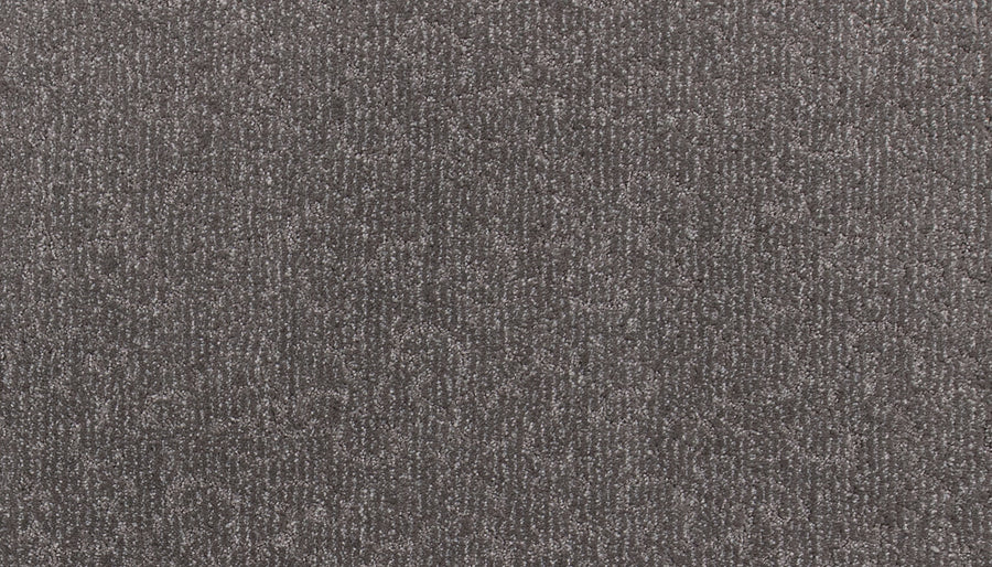 Close-up of Fleurious Pet Friendly Carpet featuring a gray textured surface with a subtle striped pattern and soft, densely packed fibers for luxurious comfort.