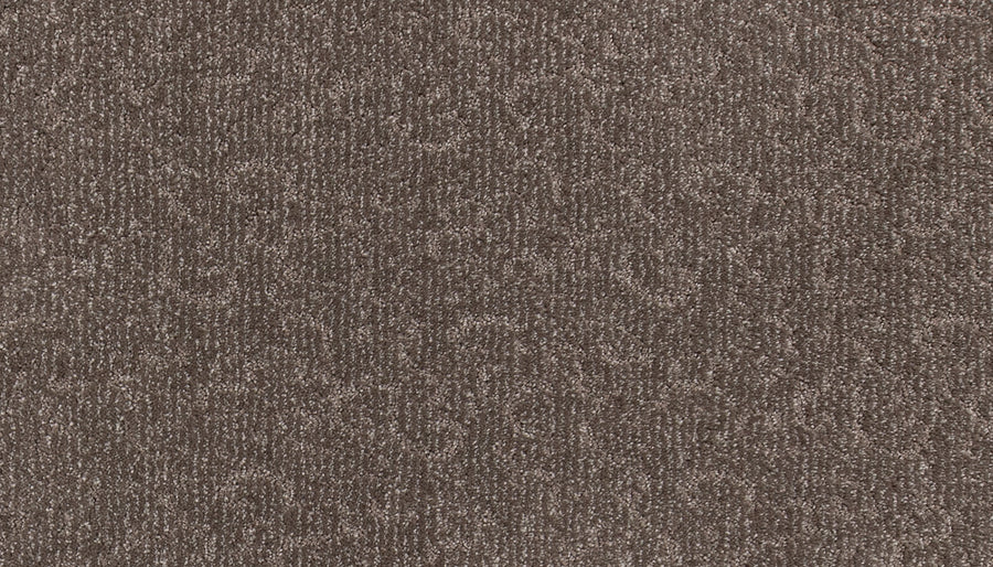 Close-up of the Fleurious Pet Friendly Carpet in brown, showcasing a subtle swirling pattern and a soft, lustrous finish that brings luxurious comfort to any room.