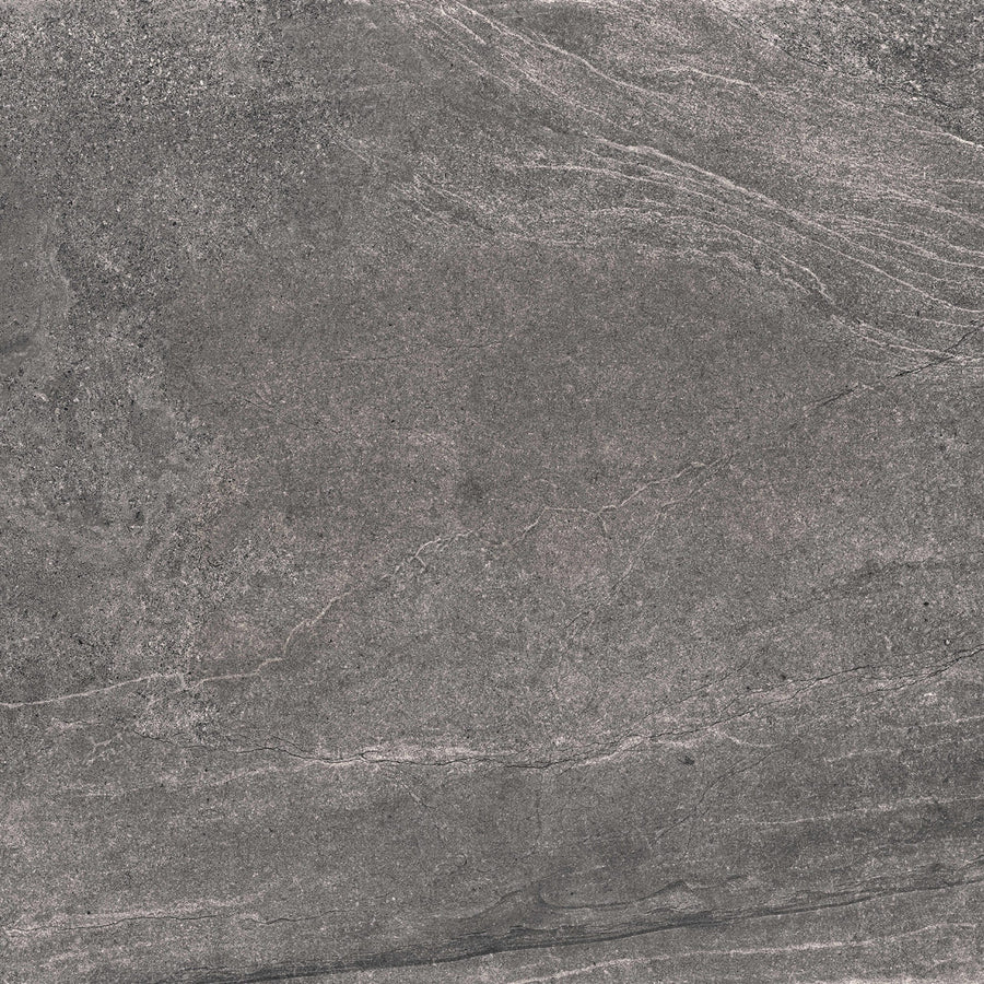 Gray stone surface with subtle white and light gray veining patterns, giving a textured and natural look. The surface has a slightly rough, matte finish reminiscent of slate or granite.