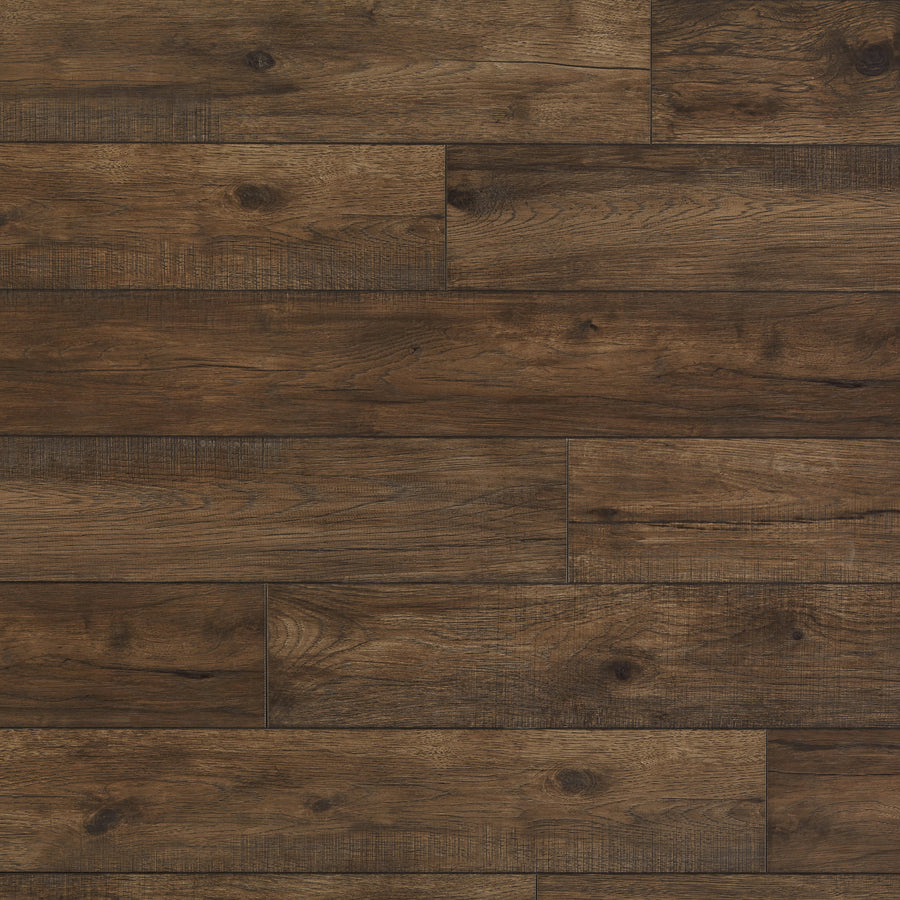 A close-up view of Hillside Hickory 7 9/16" Waterproof Laminate in Acorn, featuring dark brown planks arranged horizontally with visible natural wood grain patterns and subtle knots.