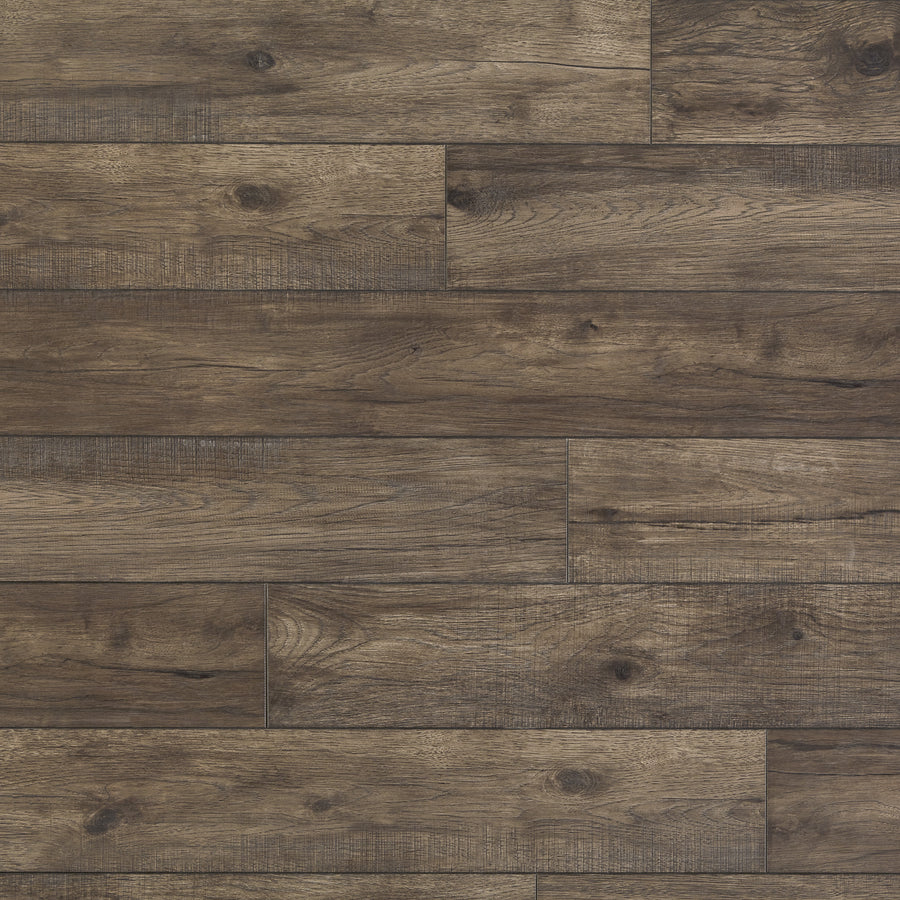 Hillside Hickory 7 9/16" Waterproof Laminate in Stone features natural grain and knots, staggered planks, and a rustic, weathered look with varied brown shades.