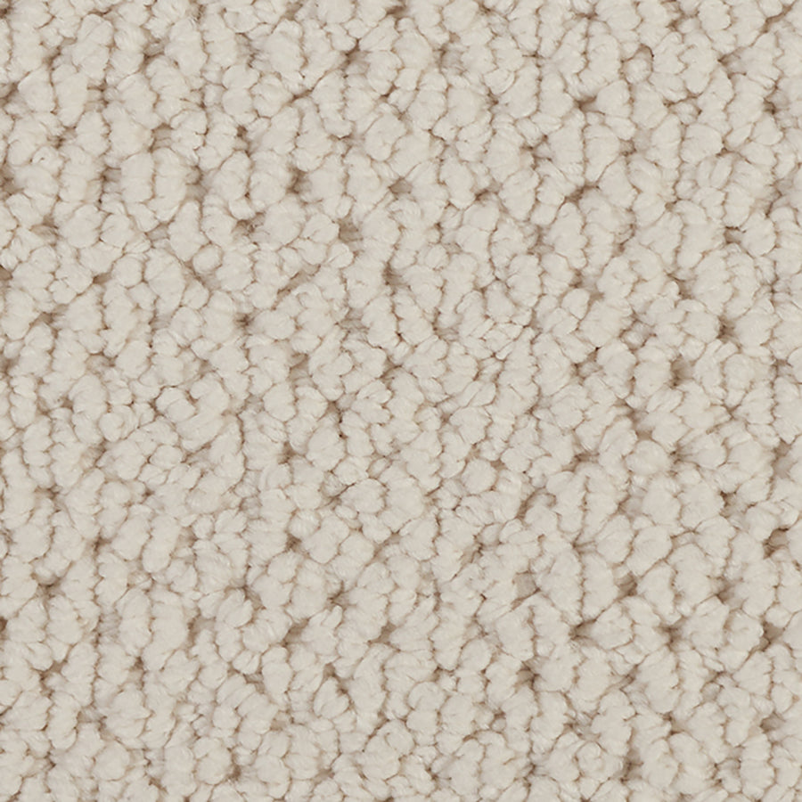 Close-up of Kinetic Detail Berber Carpet in light beige, showcasing its looped pile pattern. The soft, evenly woven surface offers a cozy and stylish option for modern interiors.