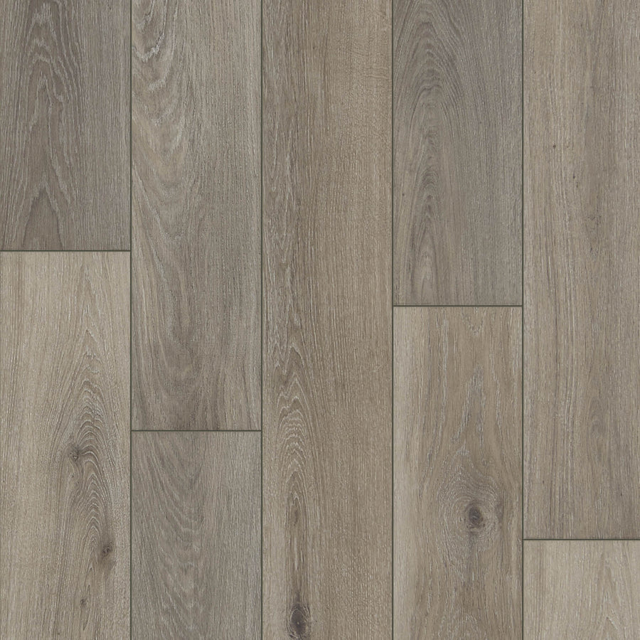 Close-up view of Haven 7 9/16" Waterproof Laminate in Oat, featuring wood grain and knot details with staggered planks in natural brown and gray tones.