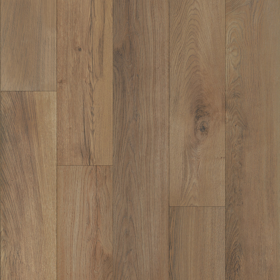 A close-up of Heirloom 7 9/16" Waterproof Laminate in Cedar Chestnut, showcasing its natural brown tones, distinct wood grain patterns, and subtle color variations.