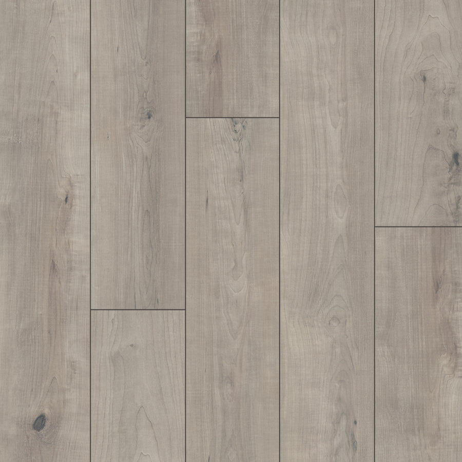 Harmony 7 9/16" Waterproof Laminate in Miso features light gray planks with natural wood grain, knots, and subtle color variations arranged in a staggered pattern for a rustic look.