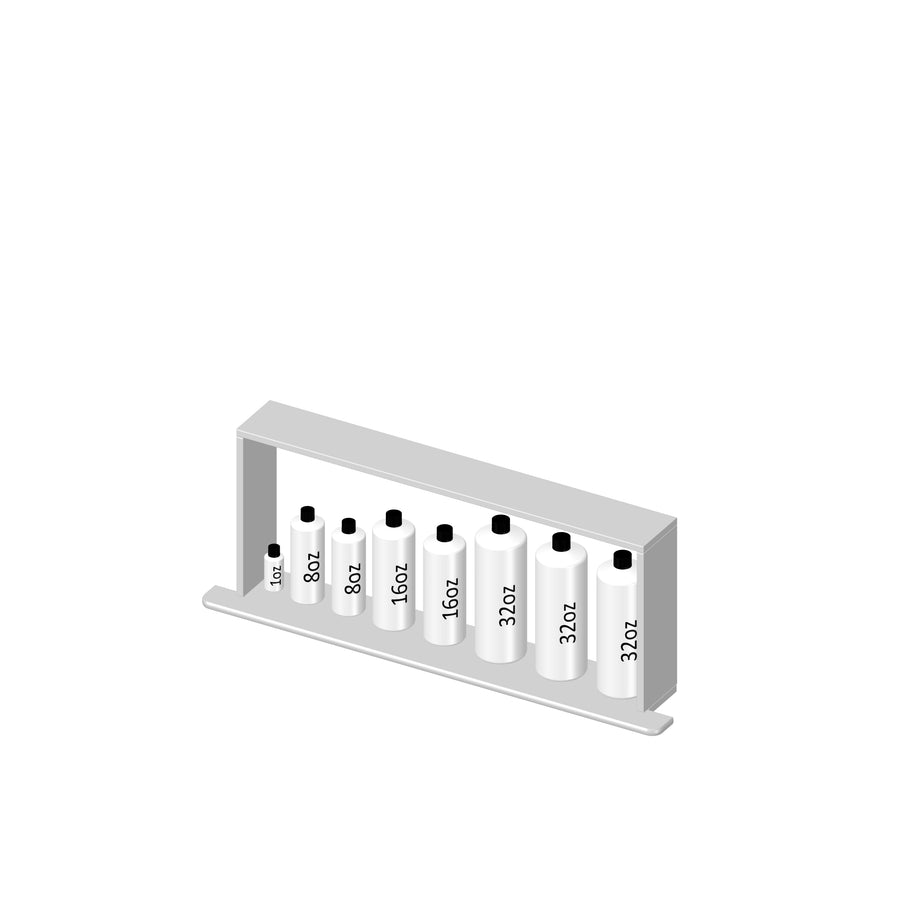 A set of six white bottles of varying sizes labeled 1oz, 8oz, 16oz, 32oz, and 32oz, arranged in a row on a white tray with a rectangular frame behind them.