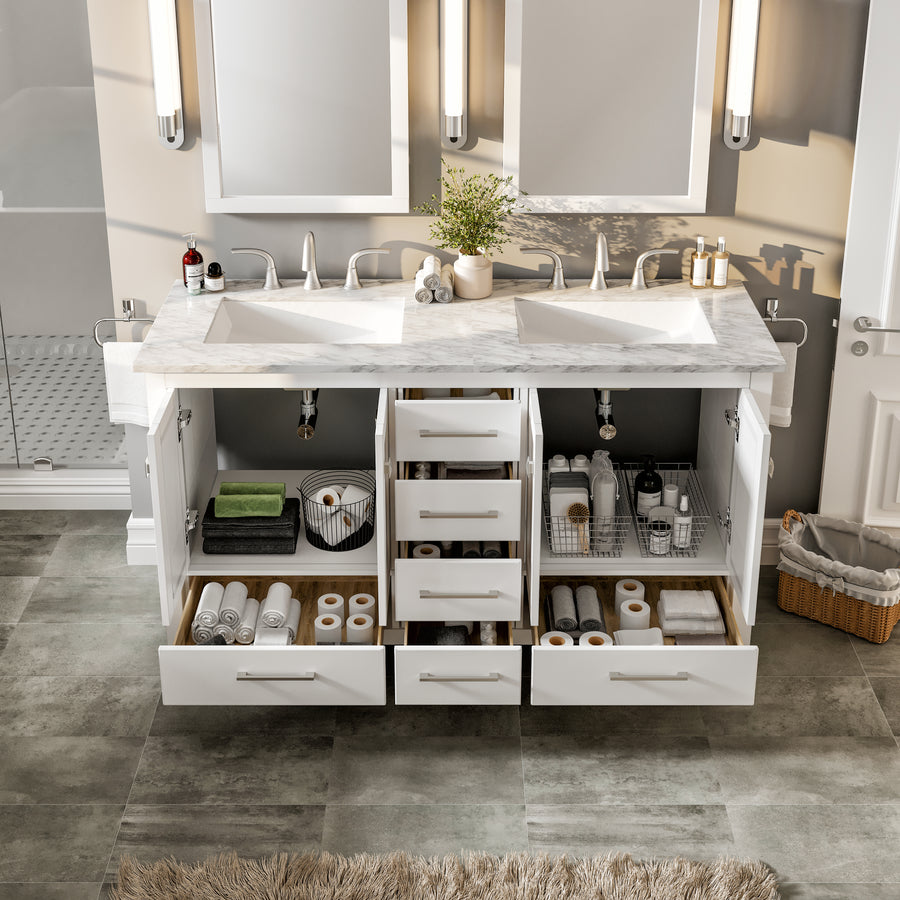 A bathroom vanity with double sinks, open drawers and cabinets neatly organized with towels, toiletries, baskets, and personal care items, set against a tiled floor and wall mirrors.