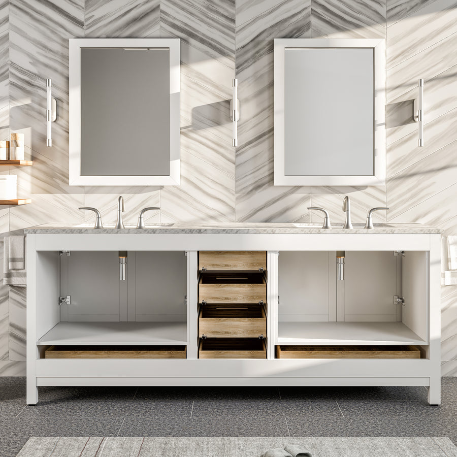 A modern bathroom with a double sink vanity, open cabinet doors and drawers showing storage space, two rectangular mirrors, and a marble-patterned wall.