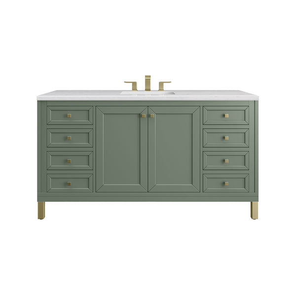 A green bathroom vanity with a white countertop, gold faucet, gold hardware, and eight drawers flanking double cabinet doors.