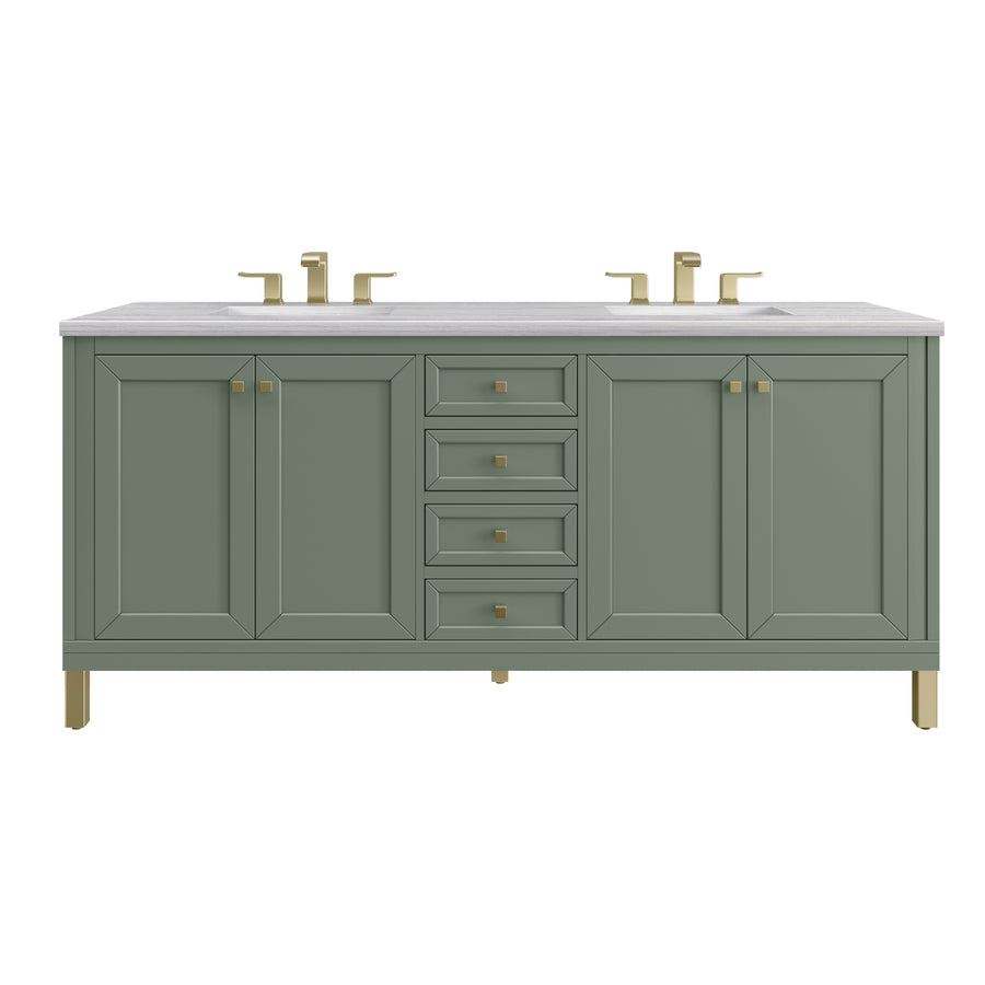 A green double-sink bathroom vanity with a white countertop, four central drawers, and two cabinets on each side. The hardware, including faucets, drawer pulls, and legs, is gold-colored.