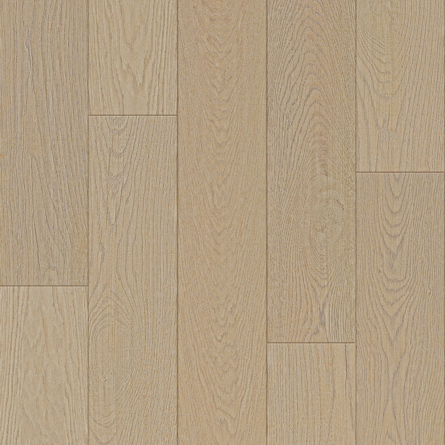 Bespoke 8" Waterproof Laminate in Cashmere features light-colored planks with visible wood grain and natural texture, arranged in a staggered pattern. Each plank has a smooth, matte finish with subtle tone variations.