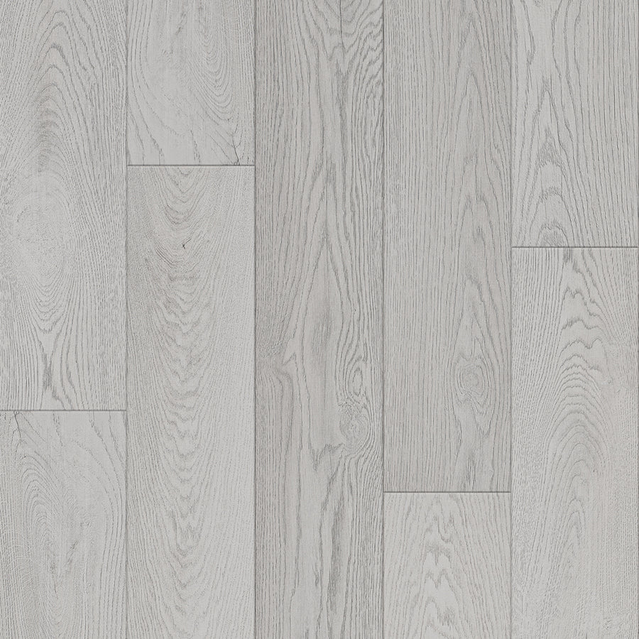 Close-up of Bespoke 8" Waterproof Laminate flooring in Wool color, highlighting light gray planks with distinct wood grain patterns and subtle color and texture variations.