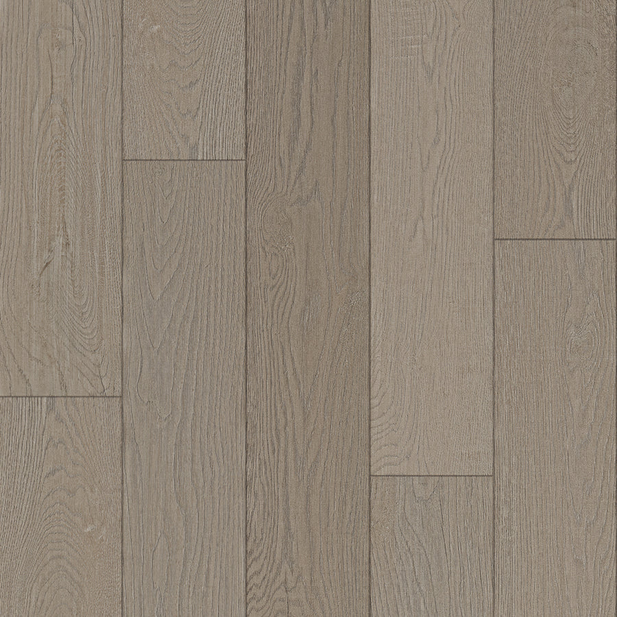 Close-up of Bespoke 8" Waterproof Laminate in Tweed, featuring light brown planks with natural wood grain and texture arranged in a staggered pattern.