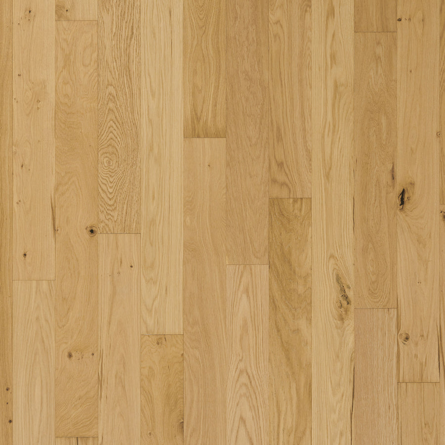 Englewood White Oak 5" Hardwood features light European white oak with a natural grain and occasional knots. The staggered planks have a smooth matte finish in varying beige and light brown shades.