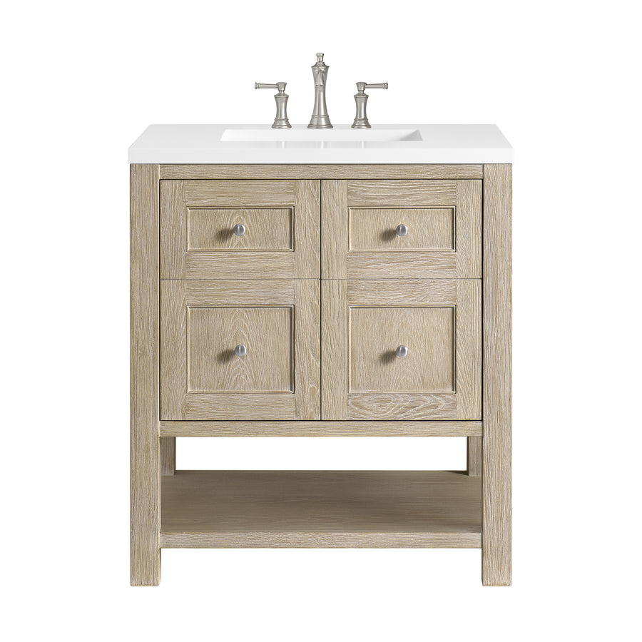 A wooden bathroom vanity with four square drawers, a white countertop, a built-in sink, silver faucet and handles, and an open shelf at the bottom, all against a white background.