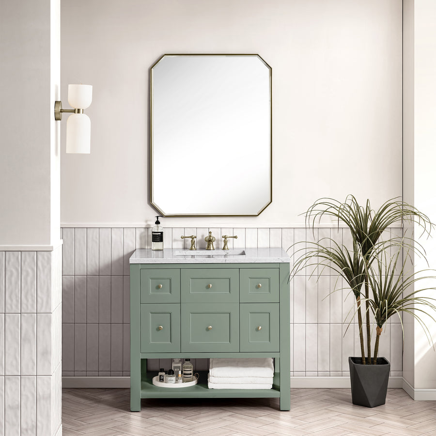 A modern bathroom featuring the Breckenridge 36" Vanity with a marble countertop, wall-mounted faucet, octagonal mirror, white sconce, potted plant, and white tile wainscoting highlights timeless transitional design.
