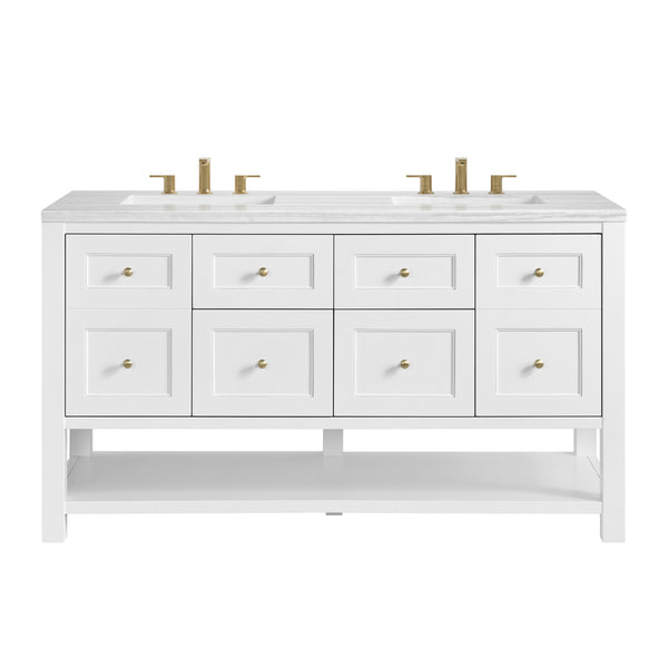 A white double bathroom vanity with a marble countertop, two sinks, gold faucets, six drawers with gold knobs, and a lower open shelf.