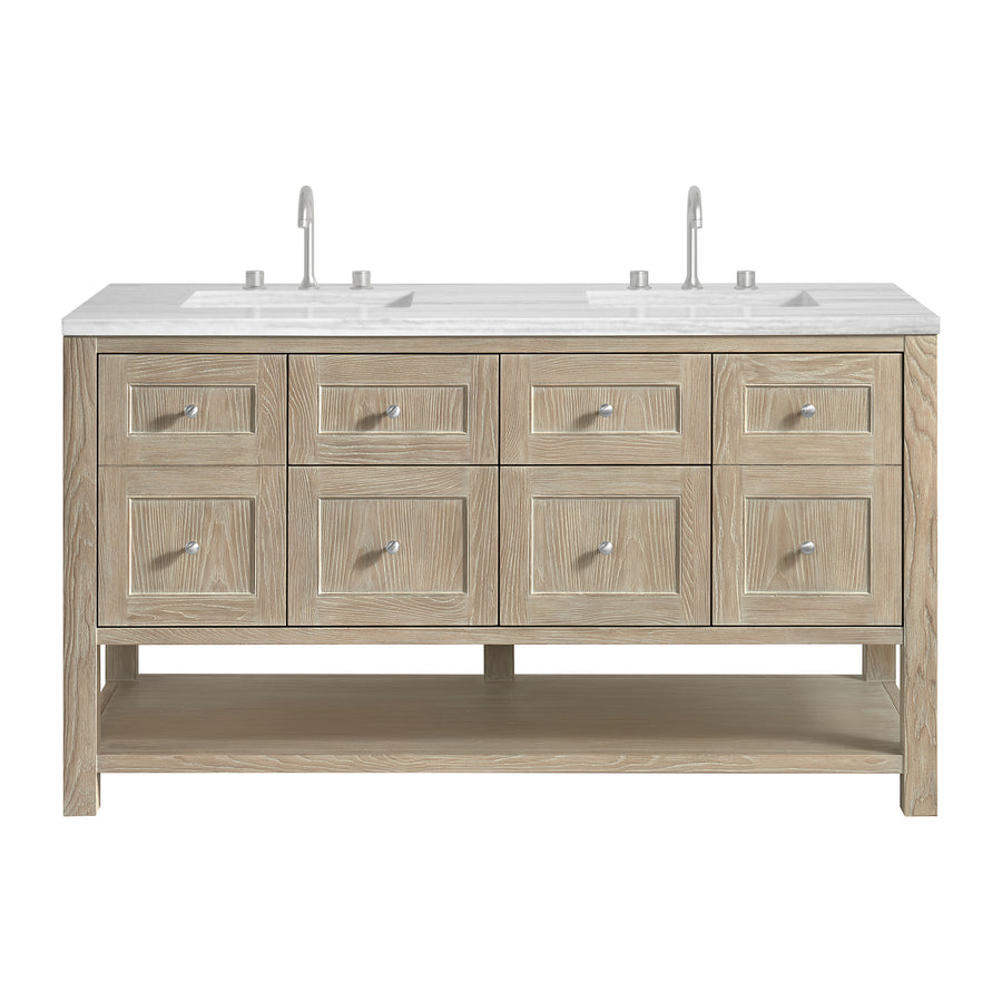 A double-sink bathroom vanity with a light wood finish, eight drawers, an open lower shelf, and a white countertop with two faucets.