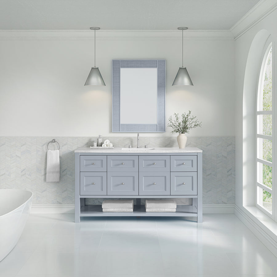 A modern bathroom featuring a Breckenridge 60" Vanity in light blue, a large mirror, two pendant lights, white walls, a towel rack, greenery in a vase, and an arched window filling the space with natural light.