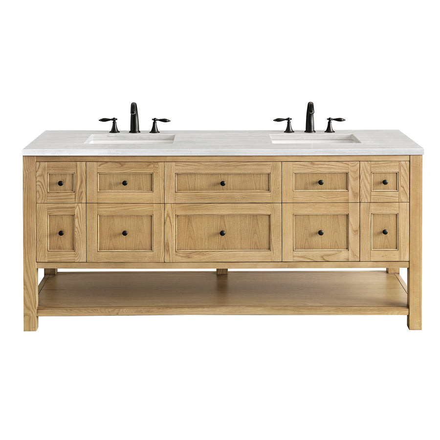 A double-sink bathroom vanity with a light wood finish, white countertop, black faucets, multiple drawers, cabinets, and an open lower shelf.