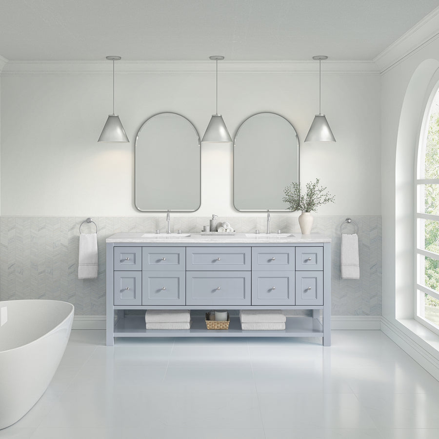 Modern bathroom featuring the Breckenridge 72" Double Bowl Vanity in light blue with double sinks, two arched mirrors, three pendant lights, a white freestanding tub, towel rings on each side, and a large window for ample natural light.