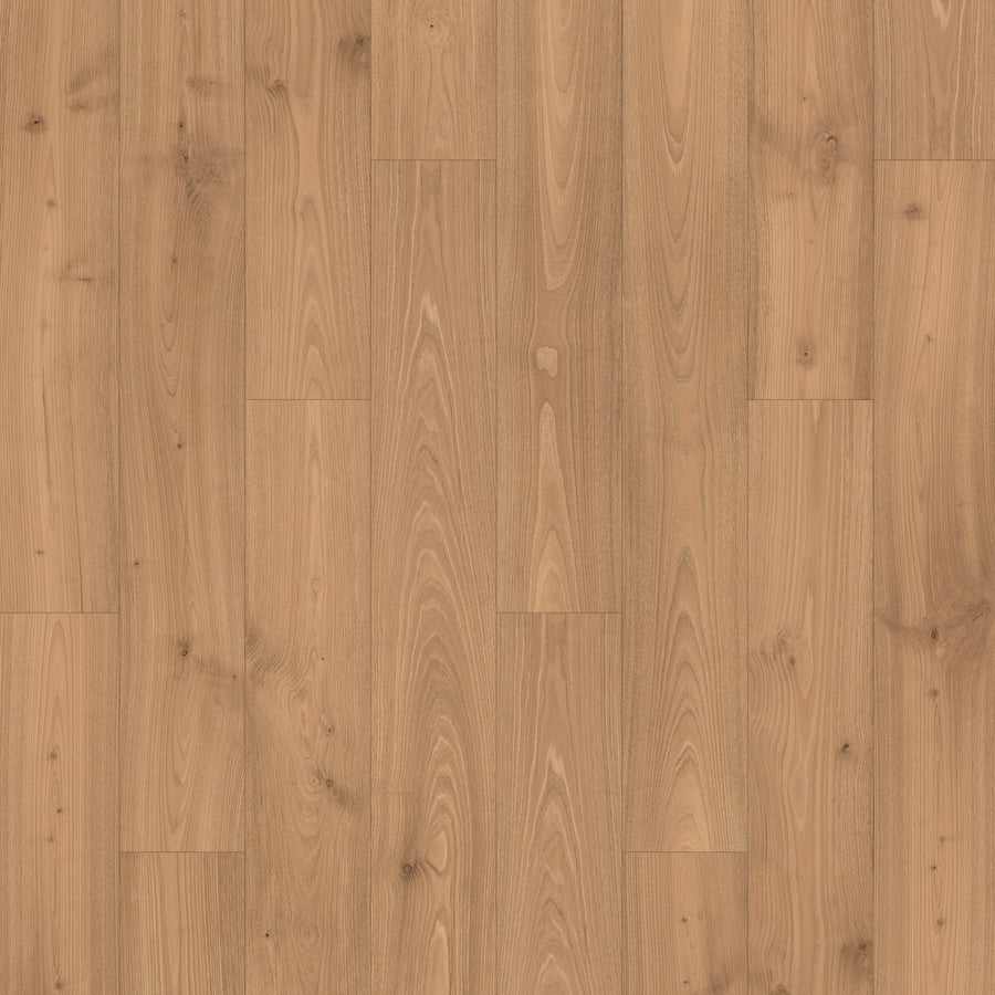 Madison Aisle 7 1/2" Laminate in TOFFEE CHESTNUT features a light brown, wood-look finish with natural grain and knots in a staggered plank layout. The smooth, matte surface is scratch resistant for lasting durability.